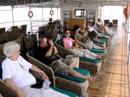 Group relaxing on the upper deck of the rv charaidew. Photo by Rick Taylor. Copyright Borderland Tours. All rights reserved. 201