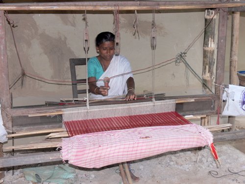 Looming silk in a river village. Photo by Rick Taylor. Copyright Borderland Tours. All rights reserved. 201