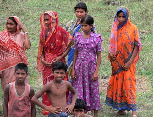 Women on the bank watching our boat. Photo by Rick Taylor. Copyright Borderland Tours. All rights reserved.  201