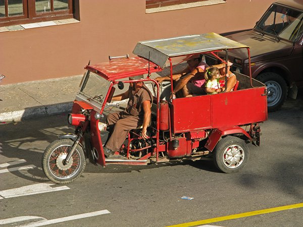 Motorcycle taxi by C Alan Morgan