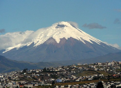 Cotopaxi with quito in foreground. Photo by Dave Semler and Marsha Steffen. All rights reserved.