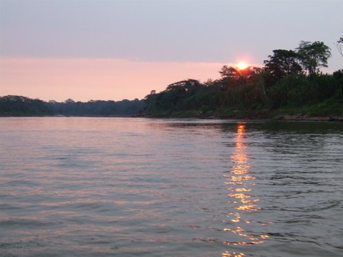 Sunset on the rio tambopata. Photo by Joe and Marcia Pugh. All rights reserved.